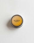 Orange cocoa lip balm on white background