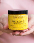 Sweet Orange Exfoliating Body Scrub in hands