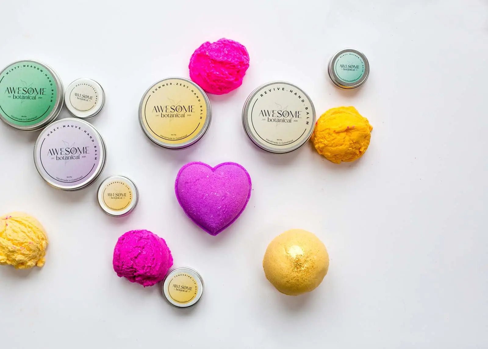 Collection of Handmade Handbalms with Bubble Scoops and Lip Balms on white background