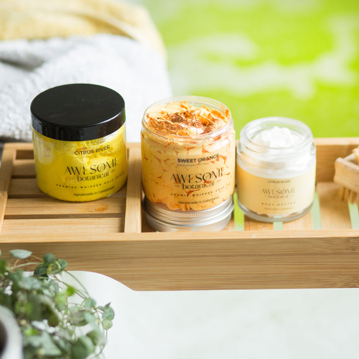 Awesome Botanical Body Scrub, Whipped Soap & Body Butter on bath rack in bathroom