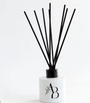 White Awesome Botanical reed diffuser with AB logo and black reeds