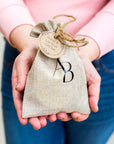 Branded Awesome botanical hessian bag with gift tag in hands