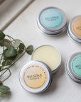 Selection of Awesome botanical Lip Balms in window with leaves