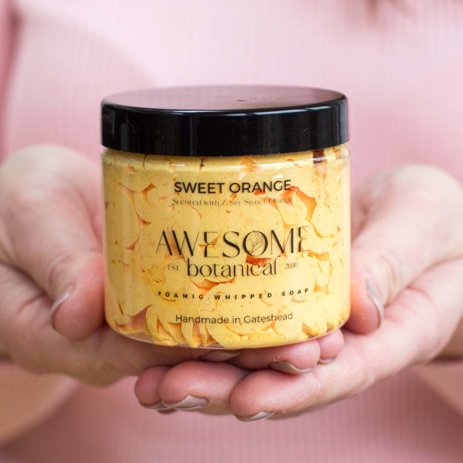 Sweet Orange Whipped soap with lid on in hands