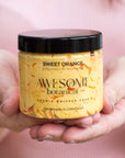 Sweet Orange Whipped soap with lid on in hands