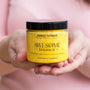 Sweet Orange Exfoliating Body Scrub in hands